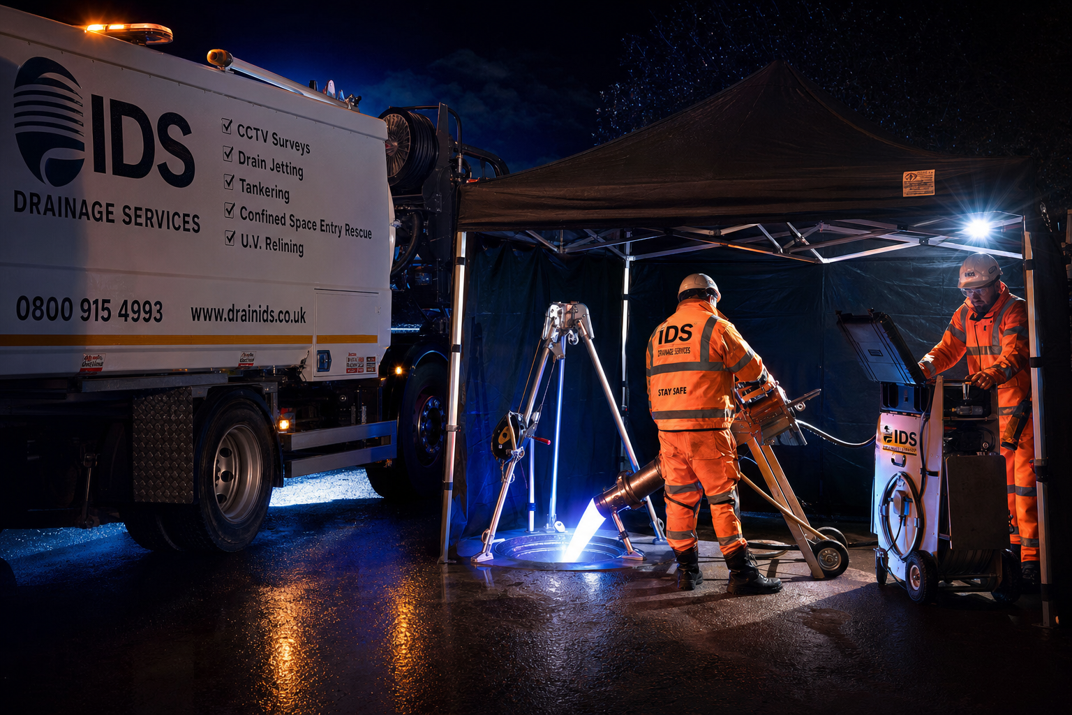 IDS crew working at night with confined space and relining equipment